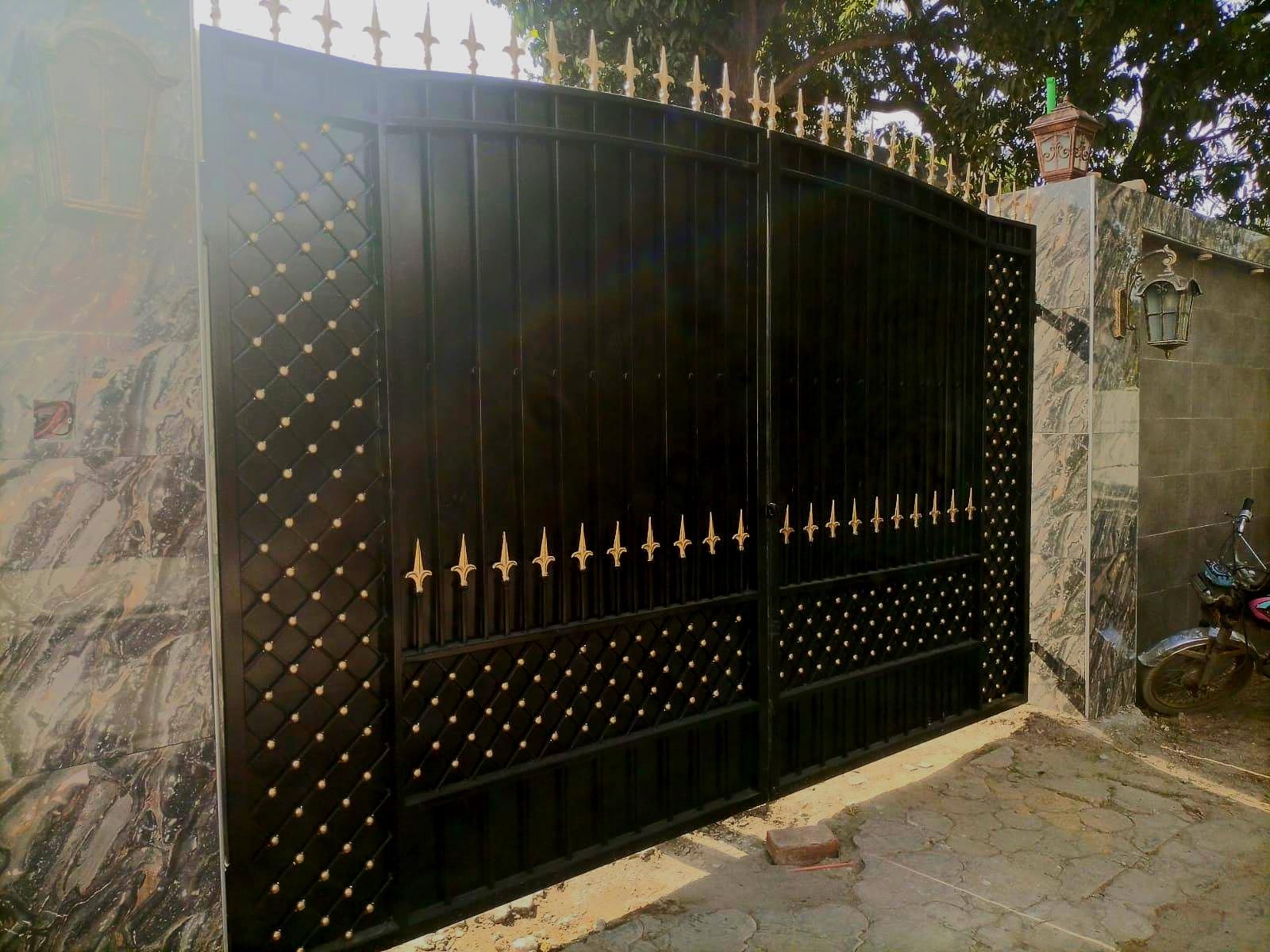 Handmade modern minimalist driveway gate with diamond lattice design, Lahore Pakistan