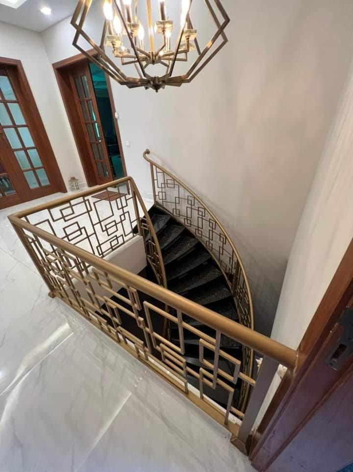 Handmade geometric fretwork stair railing for spiral staircase, Lahore Pakistan