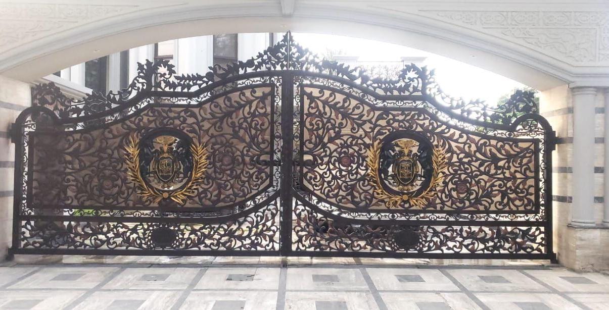 Handmade cast iron driveway gate with custom heraldic crest, Lahore Pakistan