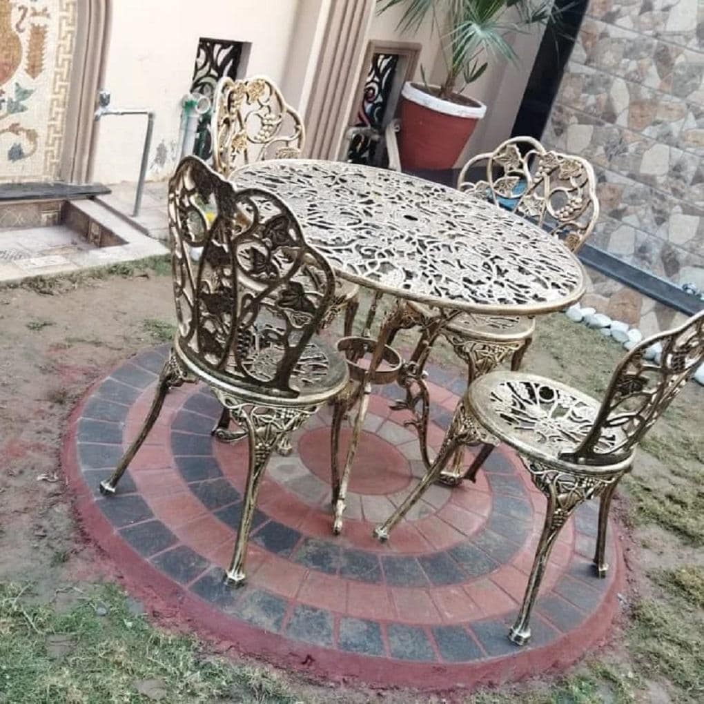 Handmade cast aluminum garden patio set with table and four chairs