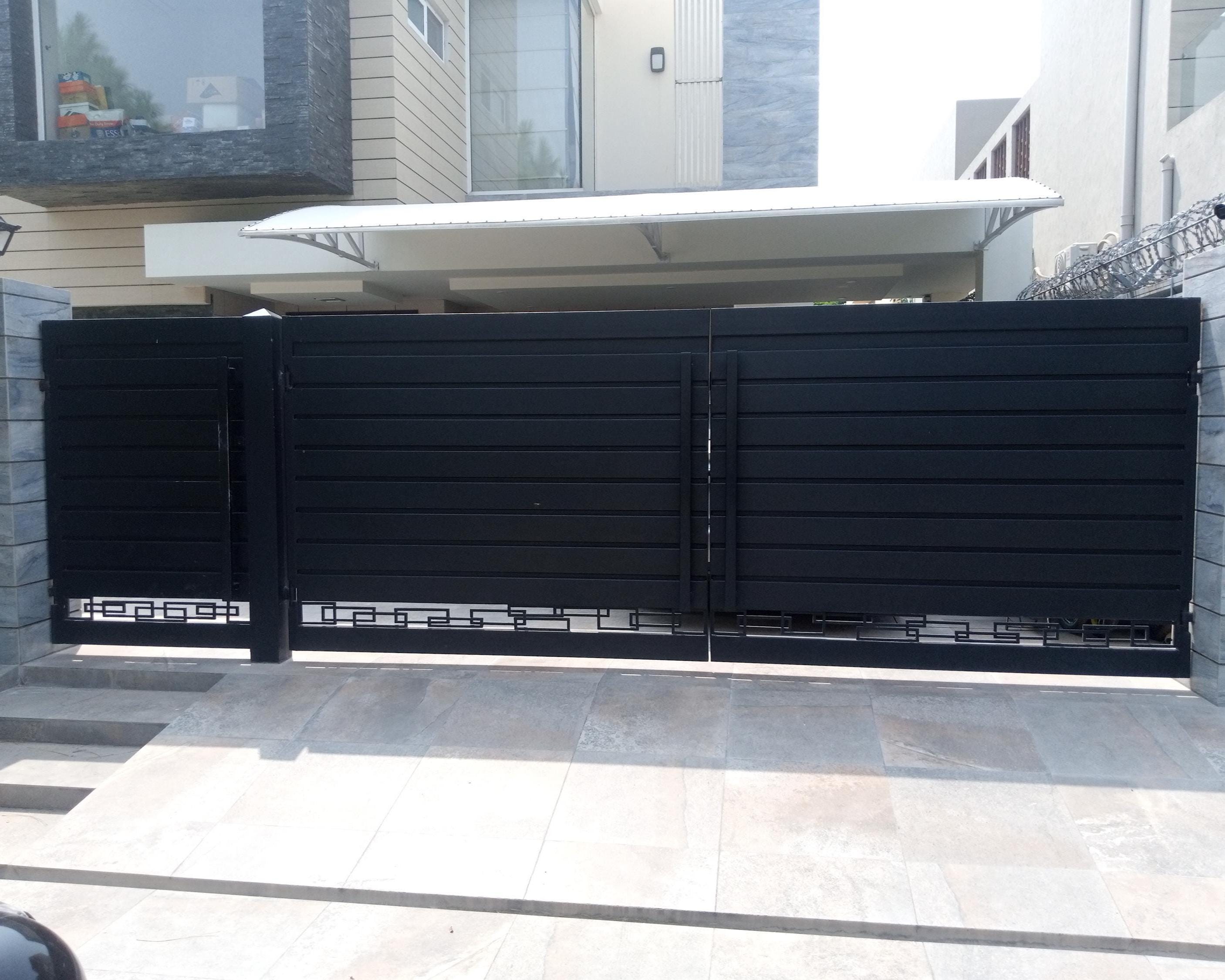 Handmade modern horizontal slat driveway gate with matching pedestrian gate