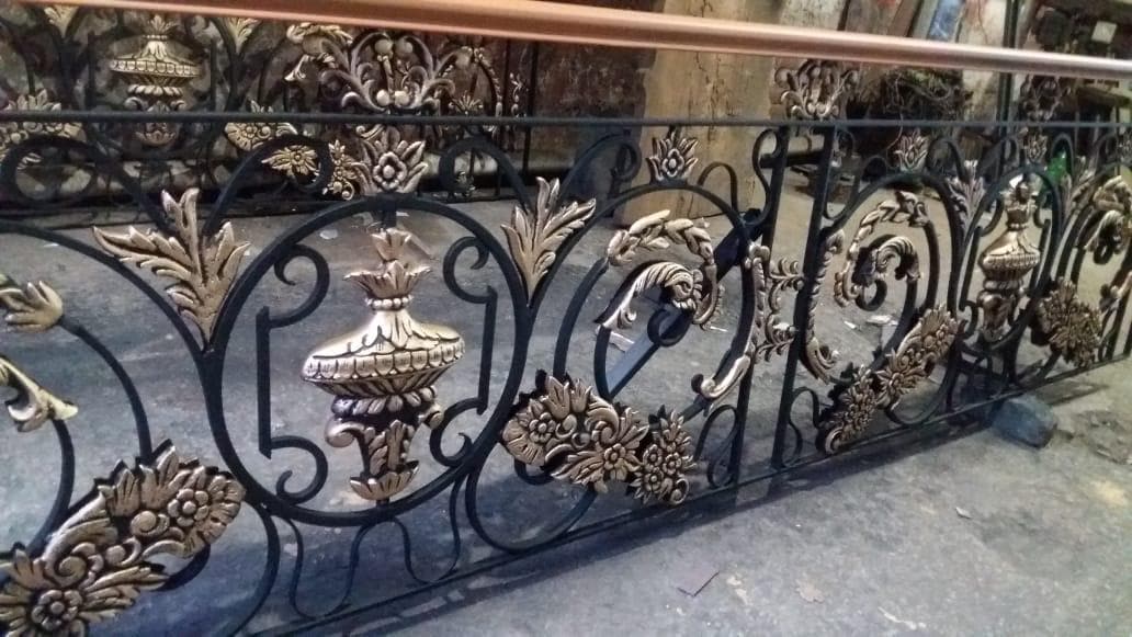 Handmade Spanish Victorian wrought iron railing with antique bronze accents and wood top rail