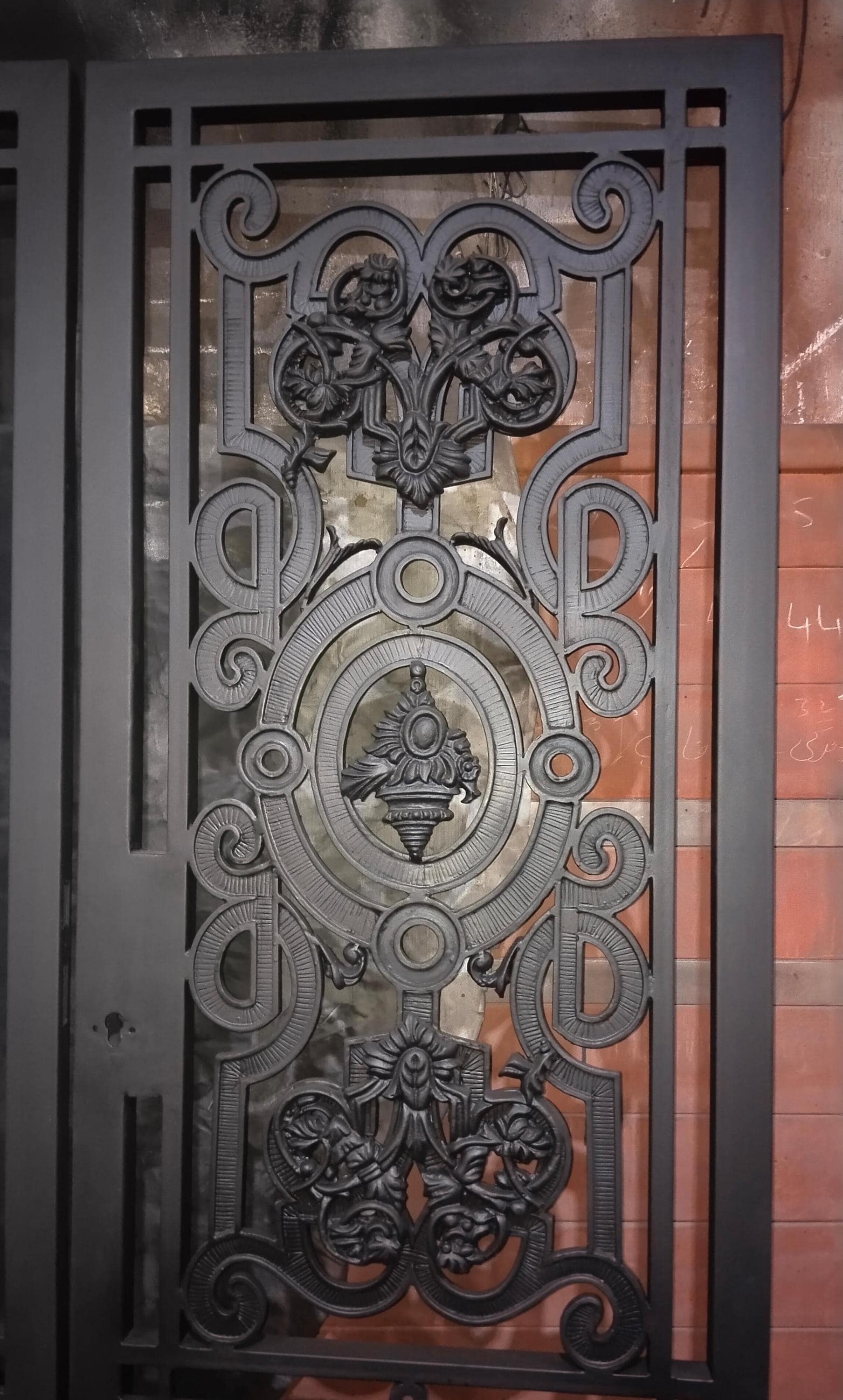 Handmade wrought iron door panel with cast medallion, Bahria Town Lahore
