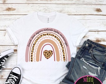 May include: White t-shirt with a rainbow design featuring a heart and the words "teach love inspire motivate listen encourage".