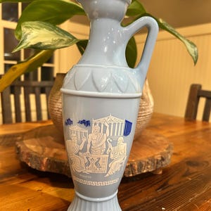 Vintage 1961 Jim Beam decanter featuring a Grecian design with Socrates in light blue milk glass-11.5” tall