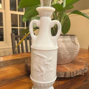 Vintage 1971 Jim Beam decanter, the "Discus Thrower" model made of white marbled "slag glass" by McGill in Canada