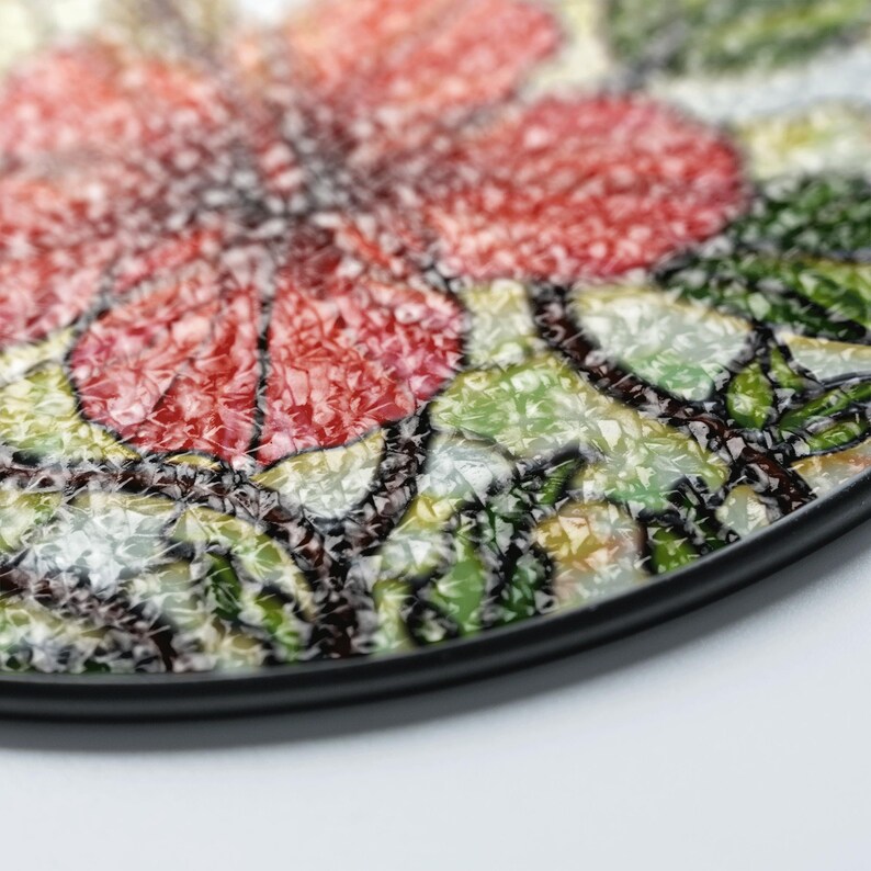 a close-up view of a colorful, textured surface with a floral pattern.