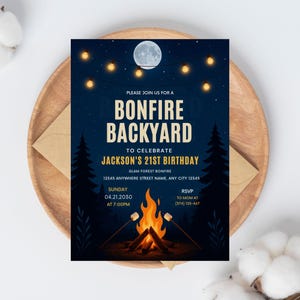 May include: A navy blue invitation for a bonfire backyard party, featuring a bonfire illustration with marshmallows, a full moon, and string lights. The text reads "Bonfire Backyard" and "Jackson's 21st Birthday".