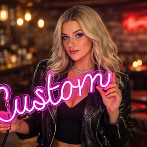 May include: A neon sign in a cursive font that reads "Custom" in bright pink. The sign is held up in front of a person wearing a black leather jacket and top. The background is a dimly lit bar.
