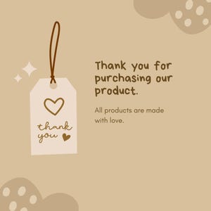 May include: A brown tag with a white heart and the text "thank you" with a small heart. The tag is hanging from a brown string. The background is a light brown with a brown abstract shape with white polka dots.