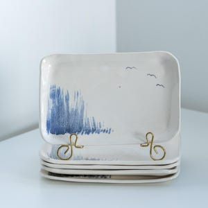 Pottery square plates. Set of 5. Birds design. Signed by artist