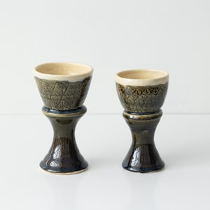 Wine goblets hand made pottery. Signed by artist. Set of 2. One of them has tiny chip, it’s seen on a picture.