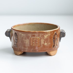 Studio pottery bowl with handles. Signed by artist. Footed bowl with fish design