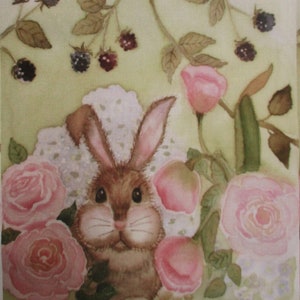 May include: Watercolor painting of a brown bunny surrounded by pink roses and blackberries. The bunny has large eyes and long ears. The background is a light green color.