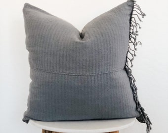 gray fringe pillow
