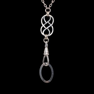 May include: Silver chain with a silver infinity knot pendant and a silver swivel clasp.