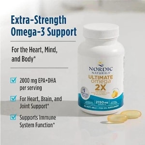May include: A white bottle of Nordic Naturals Ultimate Omega 2X fish oil supplement. The label highlights 2150mg of Omega-3, and the product supports heart, brain, and joint health. The text reads "Extra-Strength Omega-3 Support".