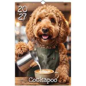 May include: A 2027 wall calendar featuring a golden-brown curly-haired dog wearing a dark green apron. The dog is pouring steamed milk from a stainless steel pitcher into a ceramic coffee cup. The text 2027 and Cockapoo are clearly visible.