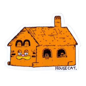 May include: An orange sticker depicting a cartoon house with a chimney and windows. The house has a face with a mustache and two cats peeking out of the windows. The text "HOUSE CAT" is below the house.