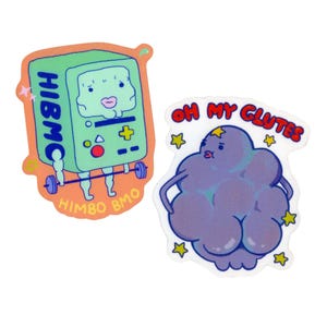 May include: Two colorful stickers. One features a green, cartoon-like character with the text "HIBMO" and "HIMBO BMO". The other sticker shows a purple cloud with the text "OH MY GLUTES" and star accents.