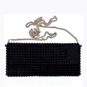 Black clutch on a chain made entirely of LEGO bricks