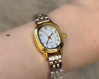 Vintage Accurist Cocktail Watch: Rotating Gold Oval Dial