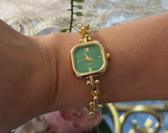 Orologio con quadrante verde placcato oro