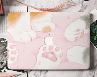 Könnte beinhalten: Eine rosa Laptop-Haut mit einem weißen Katzenpfoten-Design. Die Pfotenabdrücke haben rosa Akzente und die Haut hat einen dezenten Glitzereffekt.
