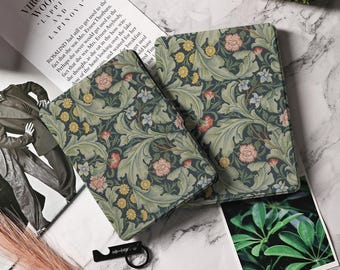 May include: Two book covers with a floral pattern in shades of green, blue, and yellow. The pattern features leaves, flowers, and vines. The covers are made of a textured material.