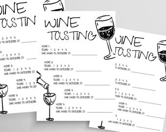 May include: Three white sheets of paper with the words "Wine Tasting" in a handwritten font. Each sheet has spaces to score and describe wines, with illustrations of wine glasses. The sheets are arranged at different angles.