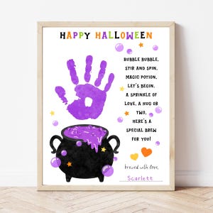 May include: A framed Halloween-themed print with a purple handprint, a black cauldron with purple potion, and the words "Happy Halloween." The print includes a poem and is signed "Scarlett."