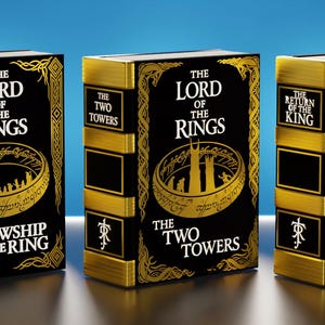 May include: Three hardcover books from "The Lord of the Rings" trilogy. Each book has a black cover with gold lettering and illustrations. The titles are "The Fellowship of the Ring", "The Two Towers", and "The Return of the King".