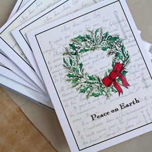 Ensemble, couronne de verdure, noeud rouge à feuilles persistantes, ensemble de 8. Ensemble de cartes de Noël Paix sur la Terre