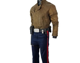 May include: A brown jacket with a unique collar and a black belt with a silver buckle. The outfit includes navy blue pants with a red stripe down the side. A holster is attached to the belt. The outfit is displayed on a mannequin.
