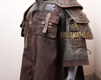 May include: A brown and green hooded coat with leather shoulder armor. The coat features multiple pockets, straps, and a patch on the chest. The shoulder armor is stitched with a circular design. The coat is displayed on a mannequin.