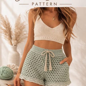May include: Image of a crochet shorts pattern. The image shows a woman wearing a cream-coloured crochet top and light green crochet shorts with a drawstring. The text "COASTAL BREEZE Crochet Shorts PATTERN" is at the top. The pattern includes sizes XS-XL and diagrams.