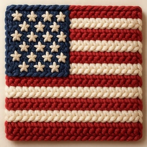May include: A square, handmade crochet piece depicting the American flag. The flag features a blue square with white stars in the upper left corner, and red and white stripes. The crochet work is detailed and textured.