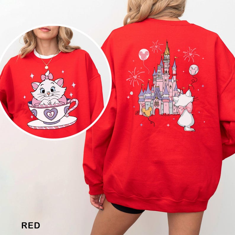A red sweater with a cartoon image of a cat and a castle on the back.
