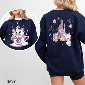 Navy sweatshirt with a cat and castle on the back.