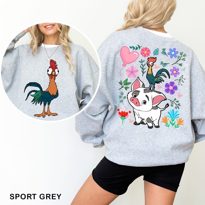 a woman wearing a sweatshirt with a rooster and rooster on it