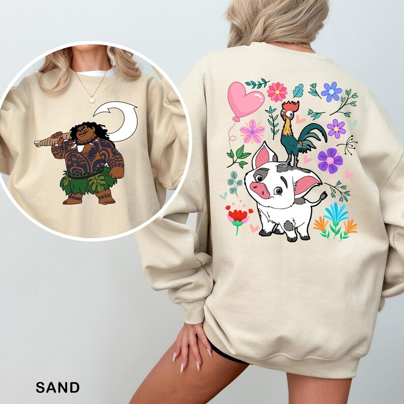a woman wearing a sweatshirt with a cartoon character on it