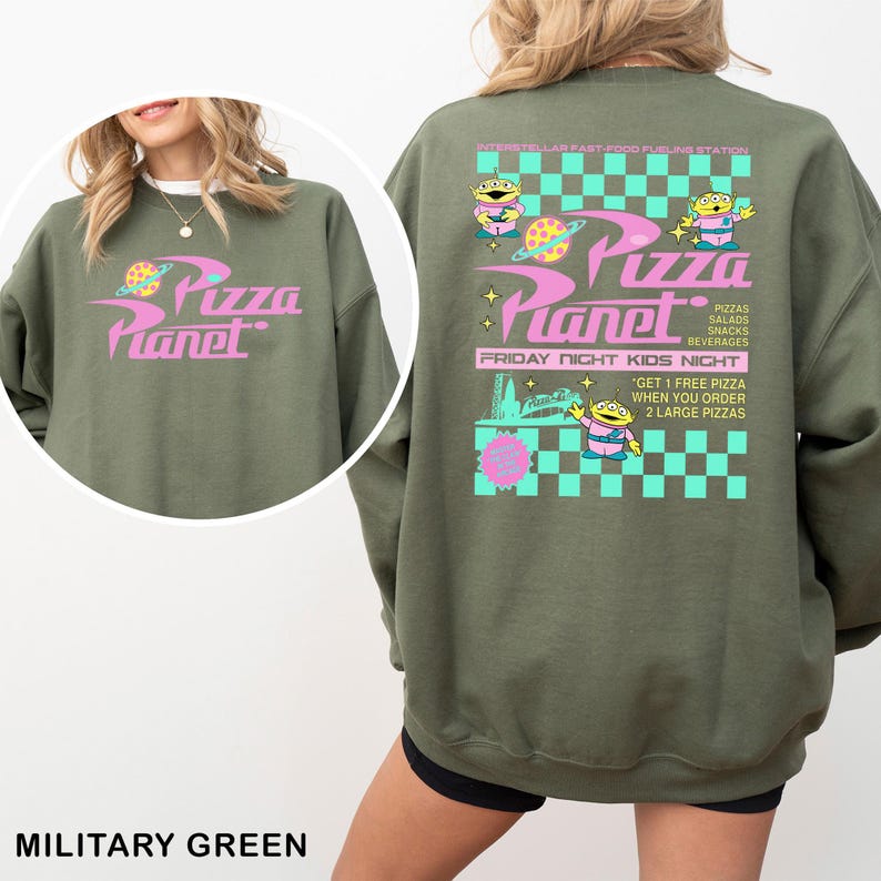 A military green sweatshirt with a colorful graphic design featuring a cartoon character and text related to a pizza planet event.