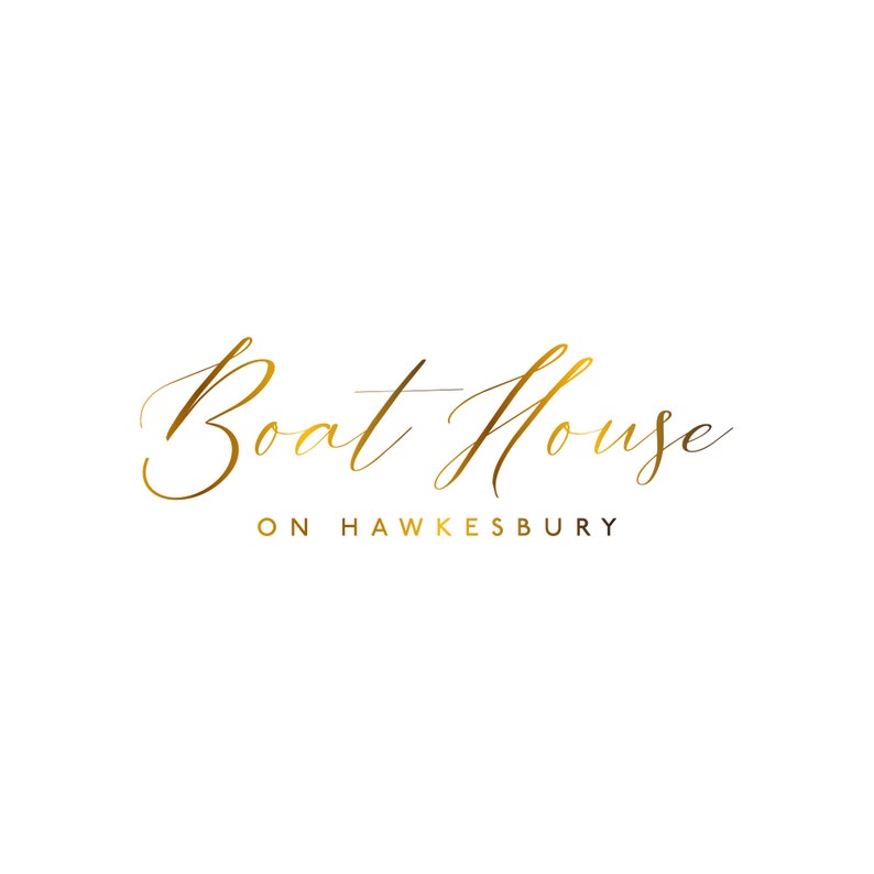 May include: Gold script logo for Boat House on Hawkesbury. The logo features a cursive font with a flowing design.