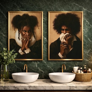 May include: Two framed portraits featuring individuals with dark skin and voluminous hair, wearing dark clothing with white ruffs, each covering their mouth with their hands adorned with multiple rings, displayed above two white vessel sinks.