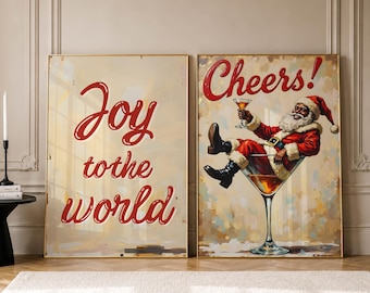 May include: Two rectangular wall art prints. The left print features the red text Joy to the world. The right print shows a Black Santa Claus wearing a red and white suit, sitting in a large martini glass, holding a drink with the text Cheers!
