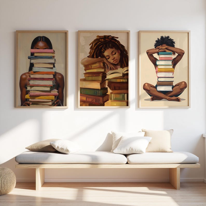 May include: Three framed art prints depicting illustrations of people with books. One shows a person with books obscuring their face, another shows a person resting on books, and the third shows a person with books in front of them.
