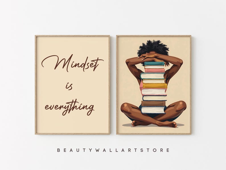 May include: Two framed art prints. One features the text "Mindset is everything" in brown script on a beige background. The other depicts a person with a stack of books on their back, arms covering their eyes.