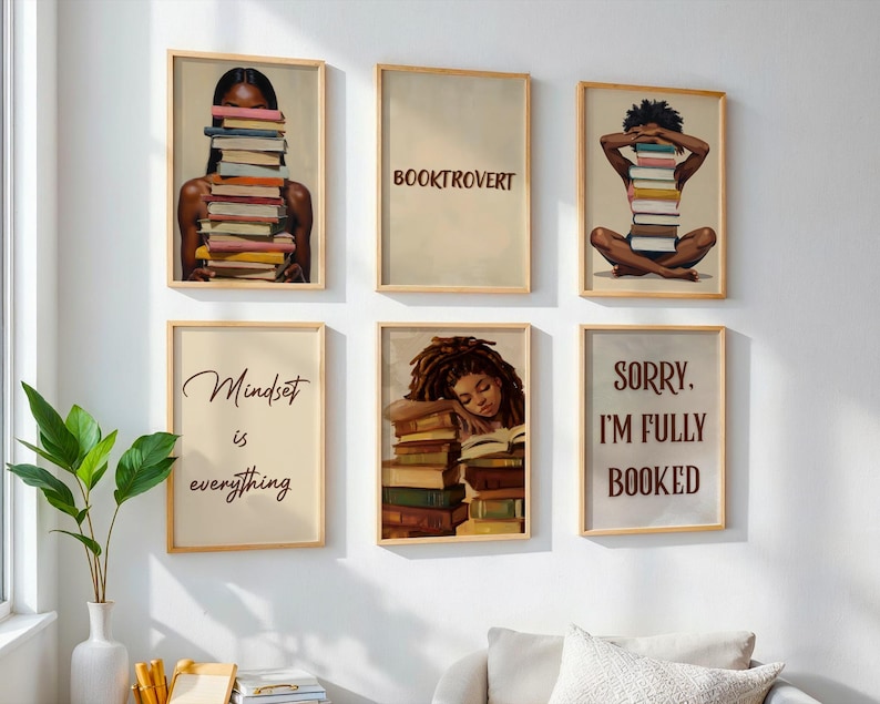 May include: Six framed art prints with a literary theme. The prints feature illustrations of people with stacks of books, and text that reads "Booktrovert", "Mindset is everything", and "Sorry, I'm fully booked".