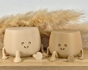 Alcancía Relaxed Piggy: Ahorra con estilo y tranquilidad, disponible en varios tamaños y colores.