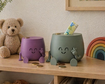 Tirelire joyeuse à l'effigie d'un visage souriant, faisant office de paiement – Cadeau unique disponible en plusieurs couleurs et tailles